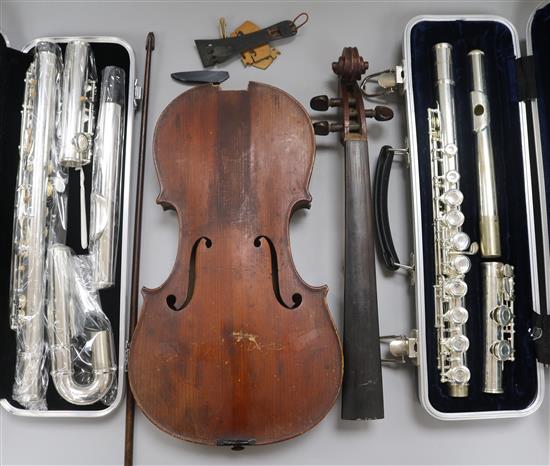 Two silver plated flutes (one with a curved head), and a violin and a bow
